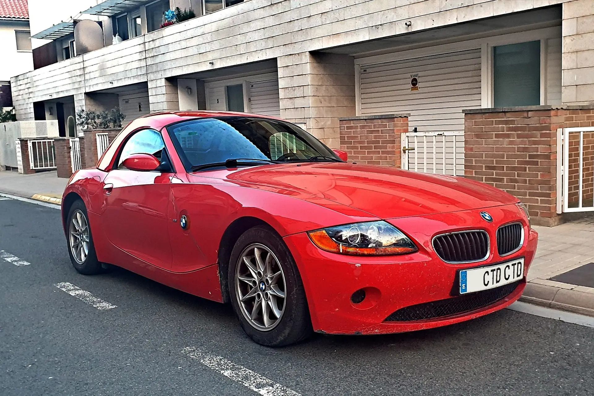 Red luxury sedan car for Zafir community CTA section